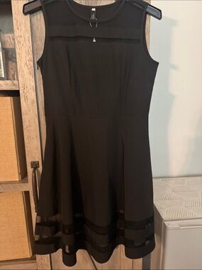 Sleeveless Black Midi Dress with Sheer Panel Accents